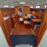 The galley and the salon. All the space is climatized (hot and cold) when connected to a 220V AC outlet. The table can be lowered and an extra double bed so the capacity in cruise mode increases from 6(2x3cabbins) to 8.