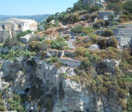 The Church of San Matteo and the rock cliff carved houses (chiafura) in Scicli.