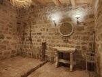 The Bathroom. Calidarium, Tepidarium and Frigidarium, all in one. The bathroom welcomes you with a cool and peaceful atmosphere where you can enjoy a good hot shower or a quick cold misting to cool down alone or with your company. Take a moment, sit down, breath slowly and relax. Sometimes massages can be provided here too.